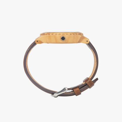Side profile view of the Yahuah: Tree of Life olive lumber wooden watch with a genuine brown leather strap and silver-tone hardware.