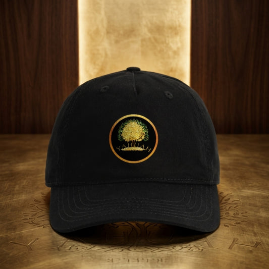 Front view of a black organic cotton dad cap featuring the circular Yahuah Tree of Life (03) logo in gold and green, centered on the crown.
