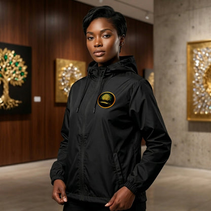 Front view of a unisex lightweight black windbreaker featuring a gold "Yahuah Tree of Life" circular emblem on the chest and a larger gold graphic on the back