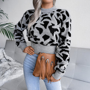 Suéter de señora con cuello simulado y cintura con estampado de leopardo