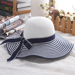 Sombrero para el sol de paja con lazo a rayas blancas y negras Wind Hepburn